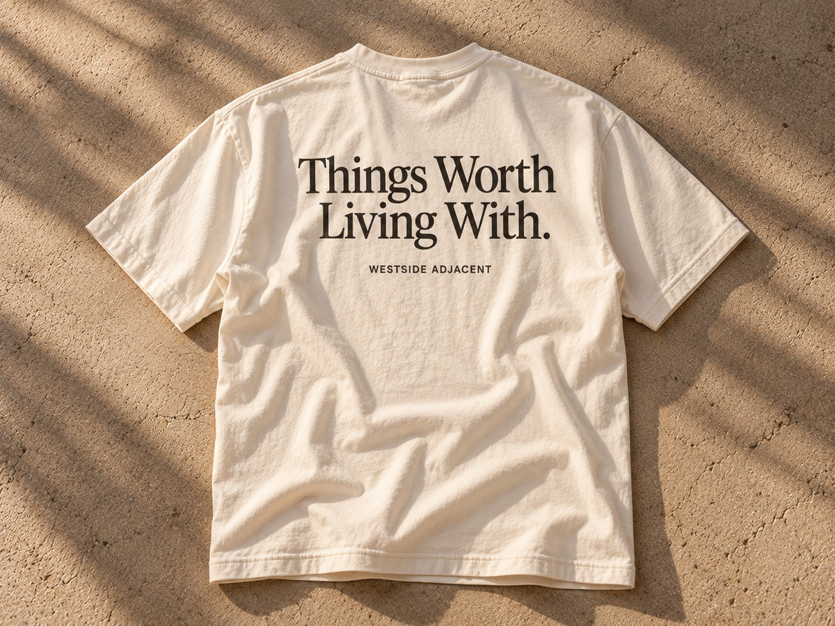 WA Tee concept in cream with Things Worth Living With. on the back