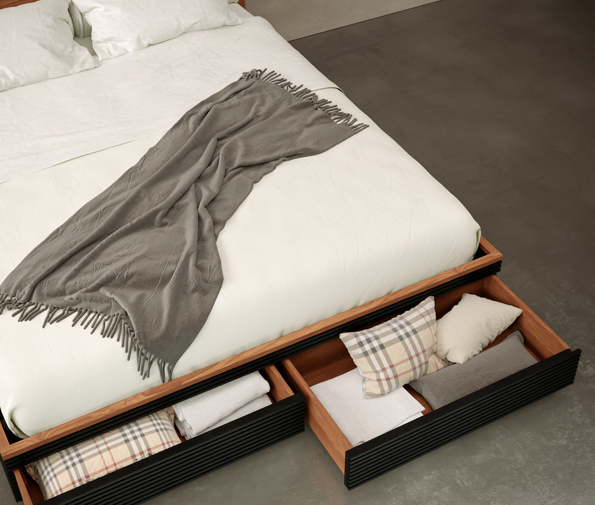 Encino Storage Bed seen from above with both under-bed drawers open, holding folded linens